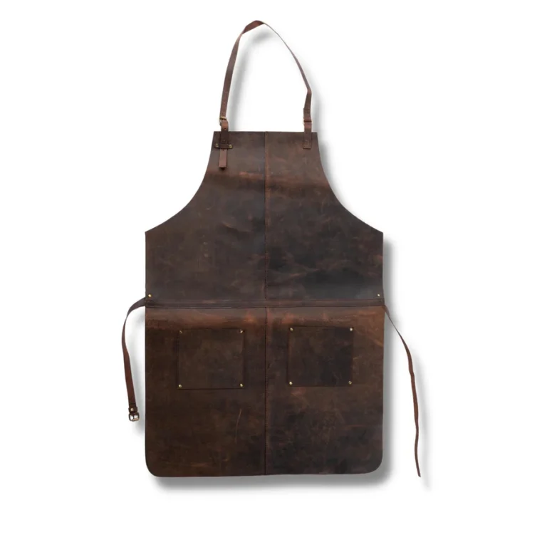 Full front view of vintage brown leather apron with dual pockets and adjustable straps for chefs and craftsmen